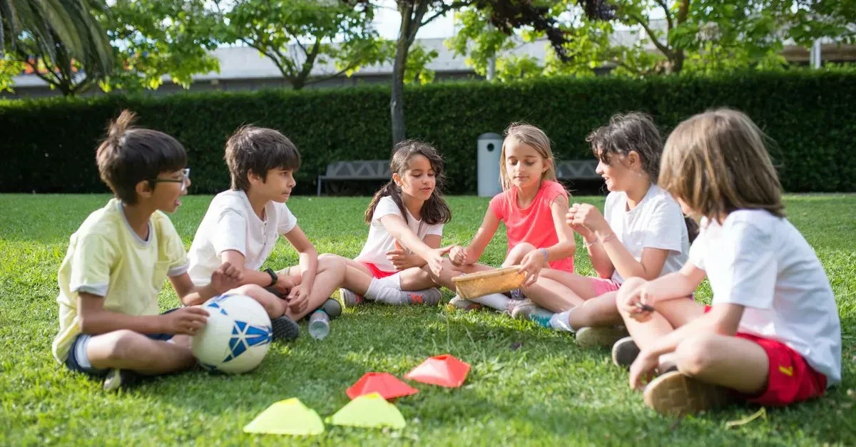 Friends having fun with the best cheap backyard games, simple affordable lawn games in a regular backyard