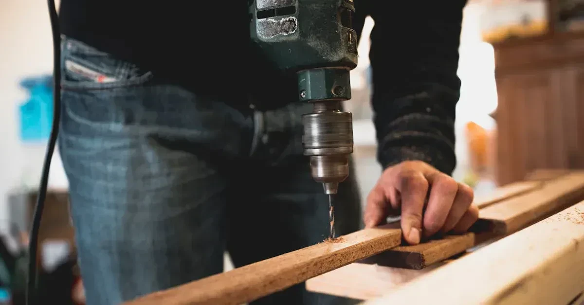 Person assembling a cornhole board frame with a drill and 2x4 lumber