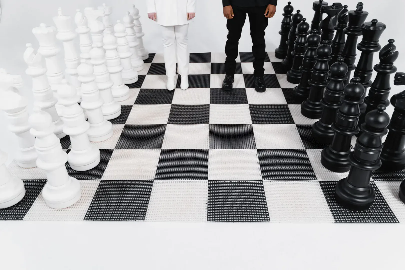 Giant Checkers set on a lawn, ready to play
