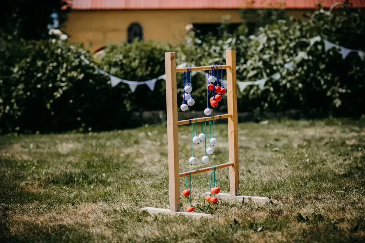 Ladder Ball set on a lawn, ready to play